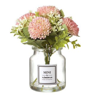 تنسيق زهور صناعية وردية في مزهرية زجاجية